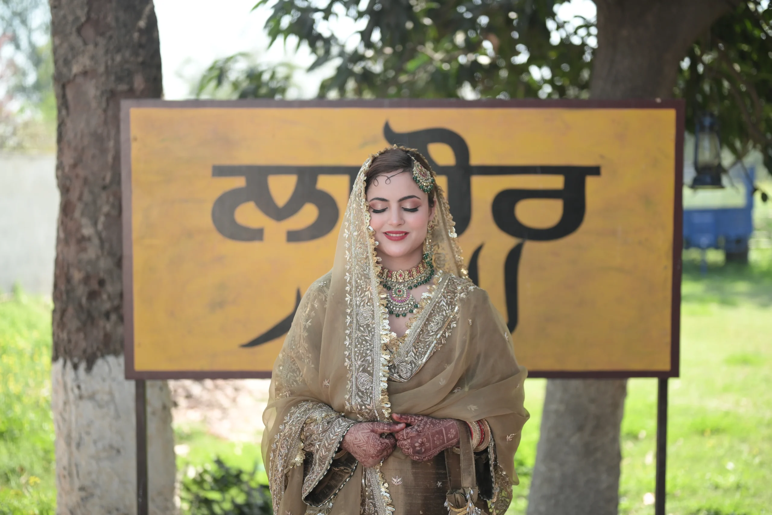 Hand-embroidered bridal suit under the Manhar name