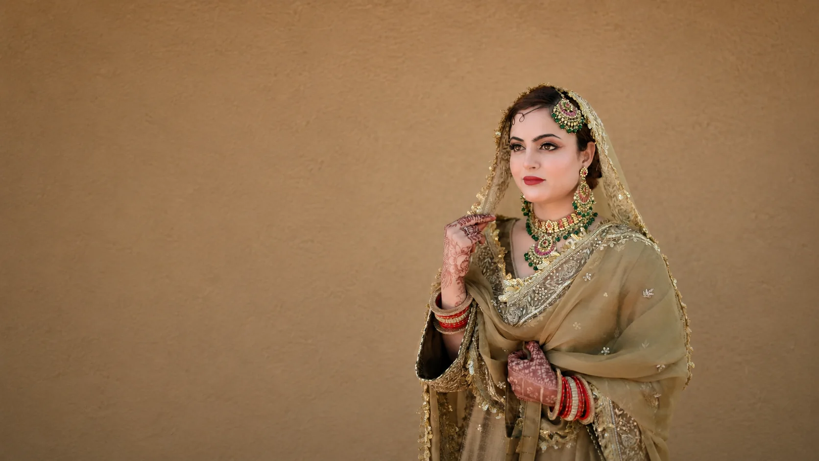 Manhar bride in hand-embroidered gold couture